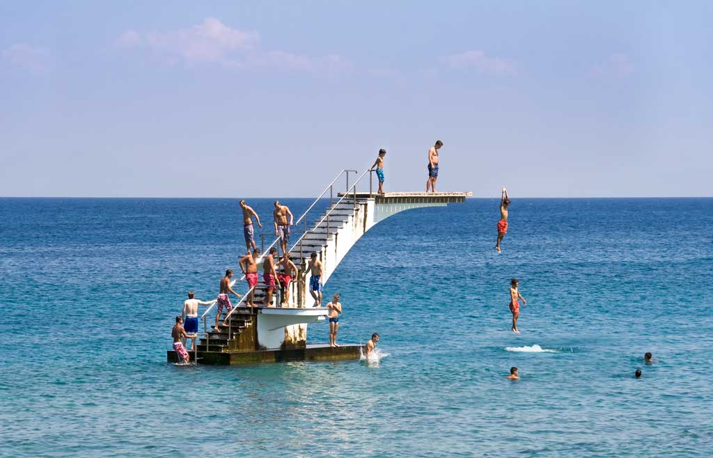 Peoplescape - people diving into the sea in Rhodes, Greece