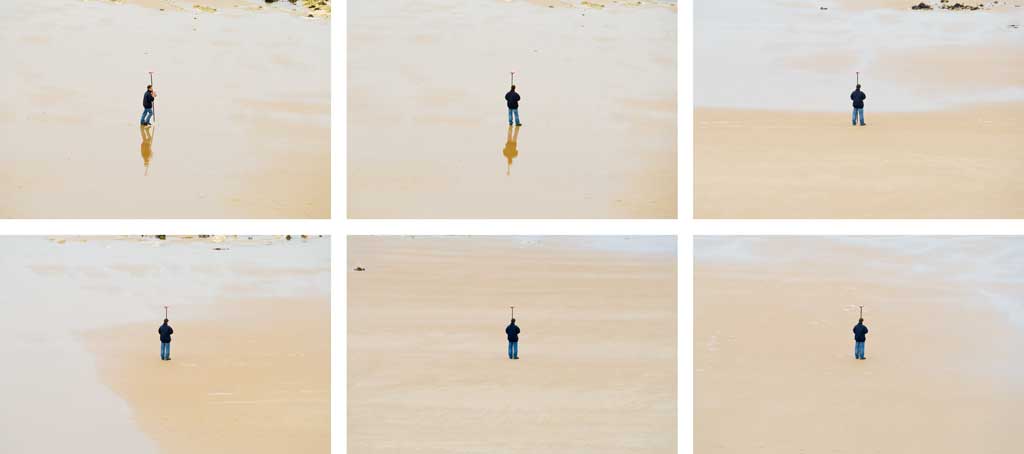 Peoplescape - man surveying the beach in Sherringham, Norfolk